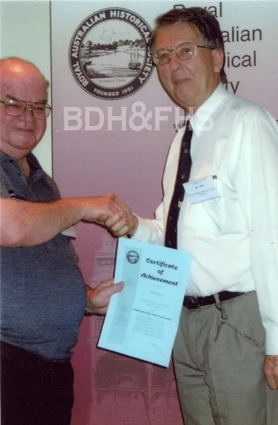 Max Rogers receiving an achievement award from Professor R Ian Jack in 2006