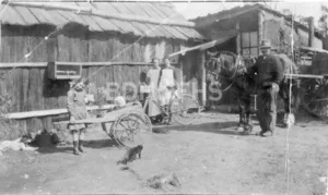 The Fuller/Kerins family outside a slab hut at Yerrinbool, around the 1930s.