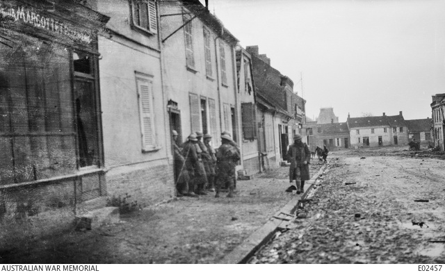 Soldiers in a street in Villers-Bretonneux, France