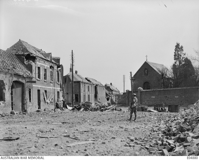 A soldier among the damaged buildings of Villers-Bretonneux