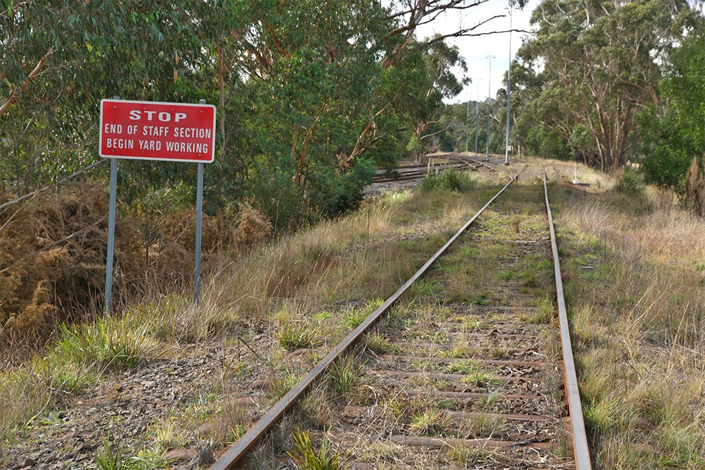 Rail tracks and yard-working sign at Braemar, photographed in 2010.