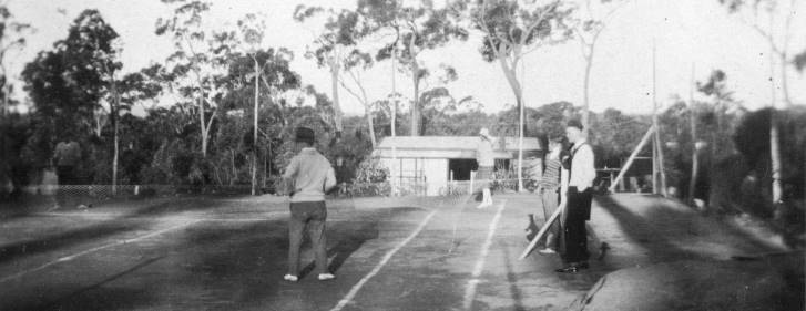 People playing tennis on the Wilson family court at Willow Vale
